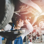 Technician performing a Land Rover service oil change