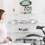 Customer shopping at a Land Rover dealership