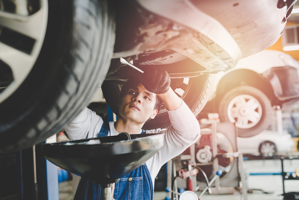 Technician performing a Land Rover service oil change