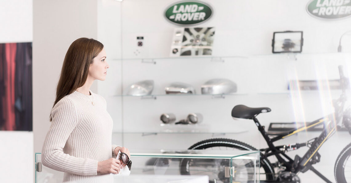 Customer shopping at a Land Rover dealership